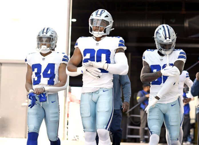 Tony Pollard (20) running back Malik Davis (34) and wide receiver CeeDee Lamb (88) exit the tunnel before the game against the Jacksonville Jaguars at TIAA Bank Field.