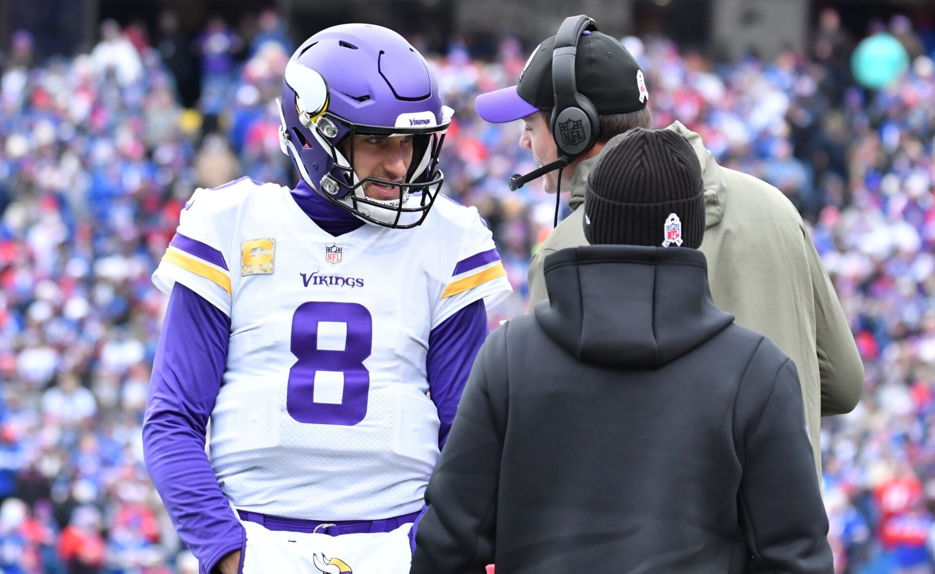 Minnesota Vikings head coach Kevin O'Connell and quarterback Kirk Cousins (8) talk on the team's sidelines.