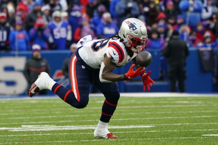 Rhamondre Stevenson (38) attempts to make a catch against the Buffalo Bills during the second half at Highmark Stadium.