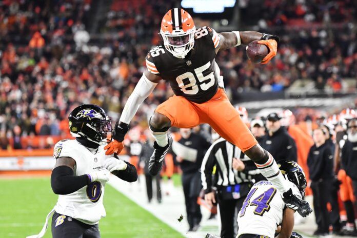 Cleveland Browns TE David Njoku (85) leaps over Baltimore Ravens CB Marlon Humphrey (44) and LB Patrick Queen (6).