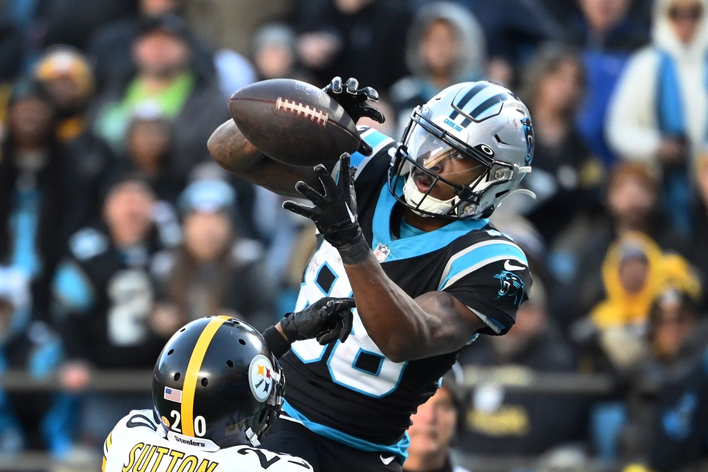 Terrace Marshall Jr. (88) attempts a catch as Pittsburgh Steelers cornerback Cameron Sutton (20) defends in the fourth quarter at Bank of America Stadium.