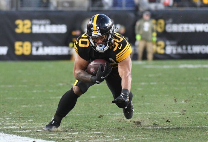 Jaylen Warren gets a first down against the Cincinnati Bengals during the first quarter at Acrisure Stadium.