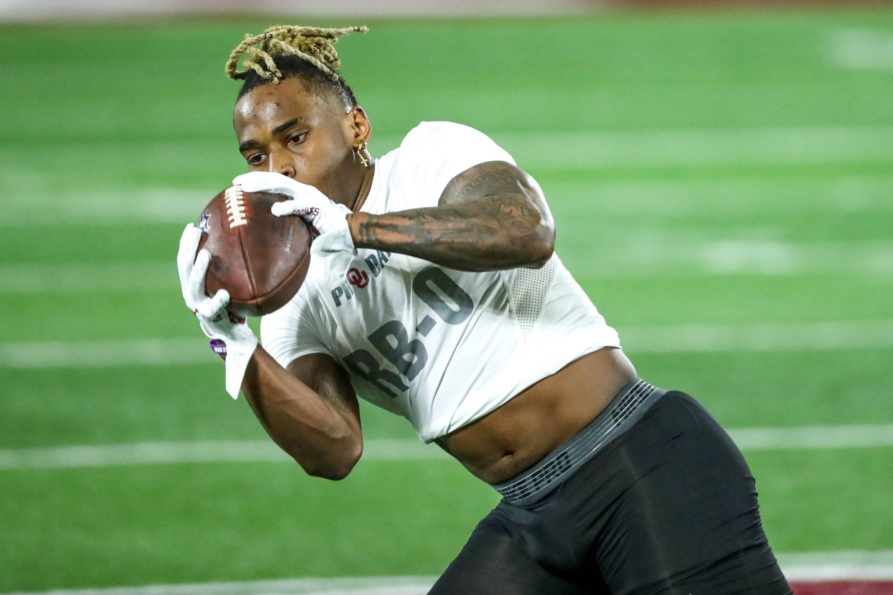 Eric Gray runs drills during OU Pro Day for University of Oklahoma football players.