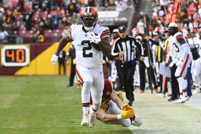 Amari Cooper (2) scores a touchdown against the Washington Commanders during the second half at FedExField.