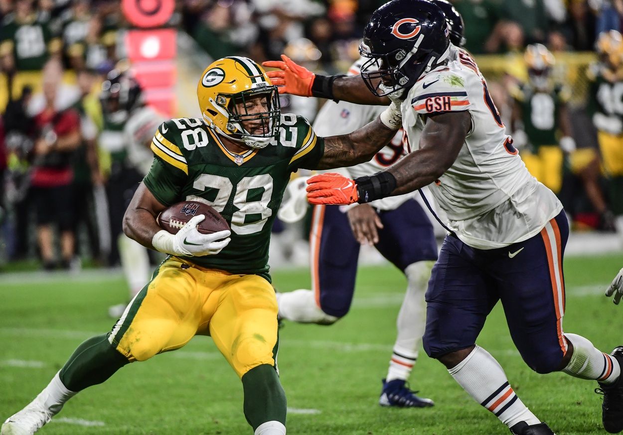 Chicago Bears DT Justin Jones (93) attempts to tackle Green Bay Packers RB AJ Dillon (28).