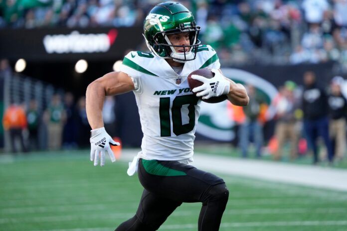 Braxton Berrios (10) runs in for a touchdown.