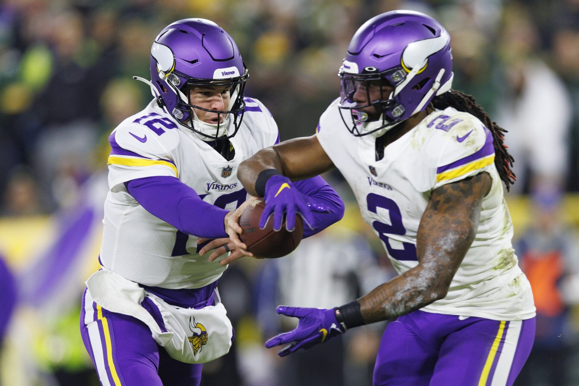 Minnesota Vikings RB Alexander Mattison (2) takes a handoff from QB Nick Mullens (12).