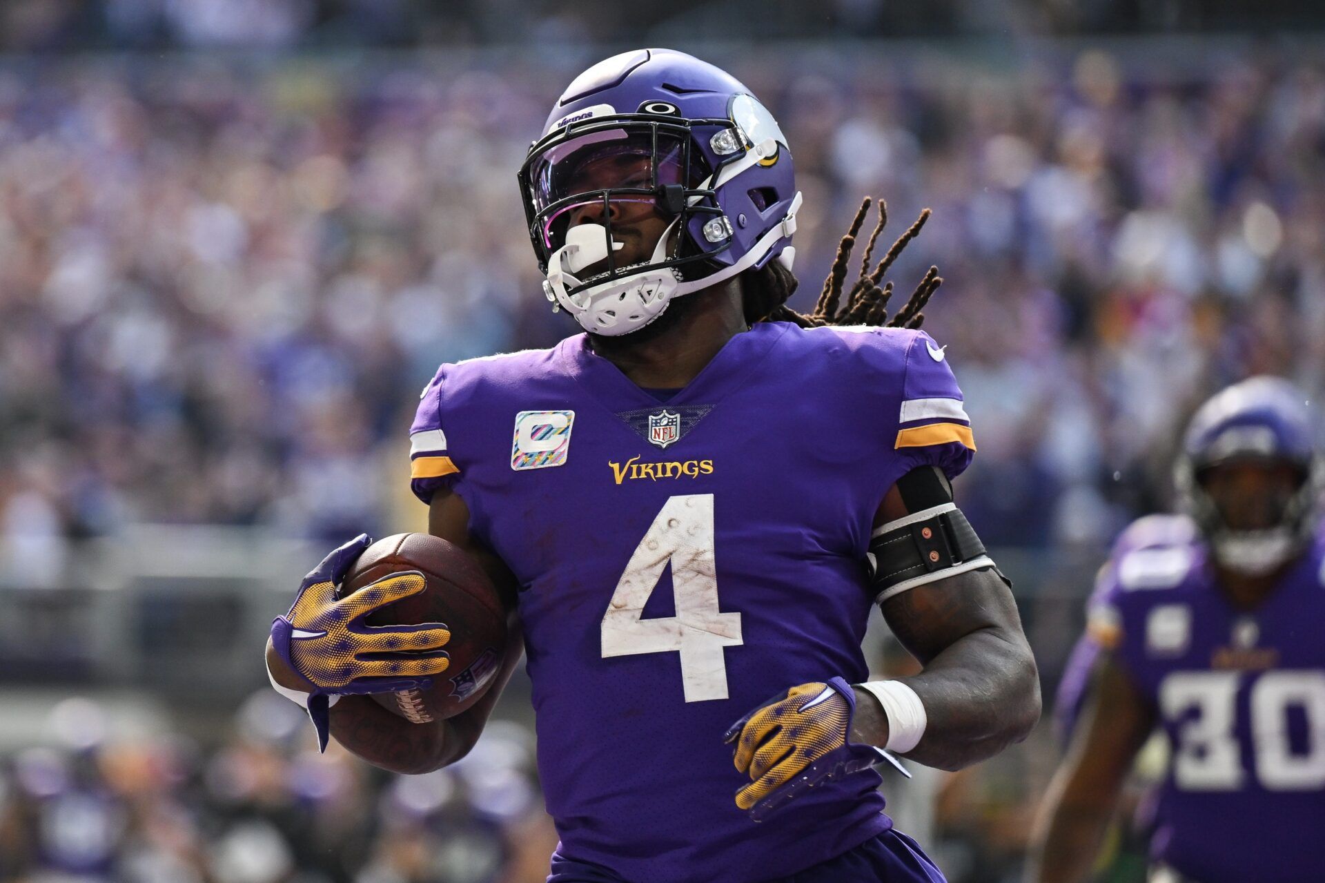 Dalvin Cook (4) reacts after a touchdown during the first quarter at U.S. Bank Stadium.