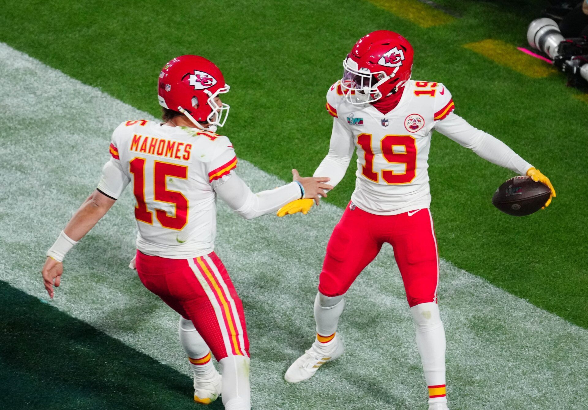 Kansas City Chiefs QB Patrick Mahomes (15) and WR Kadarius Toney (19) celebrate a touchdown in Super Bowl LVII.