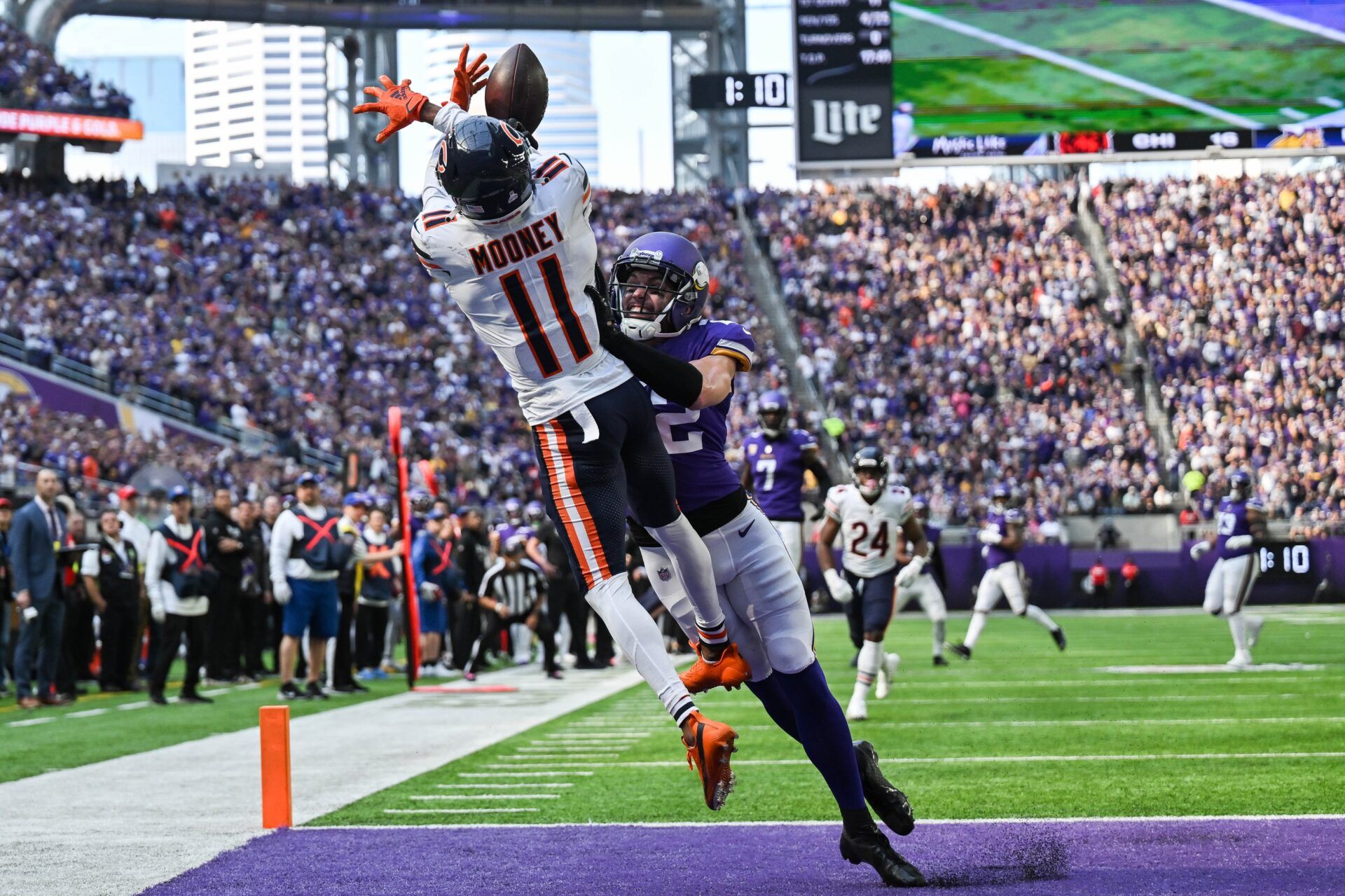 Darnell Mooney (11) tries to haul in a pass during the third quarter at U.S. Bank Stadium.