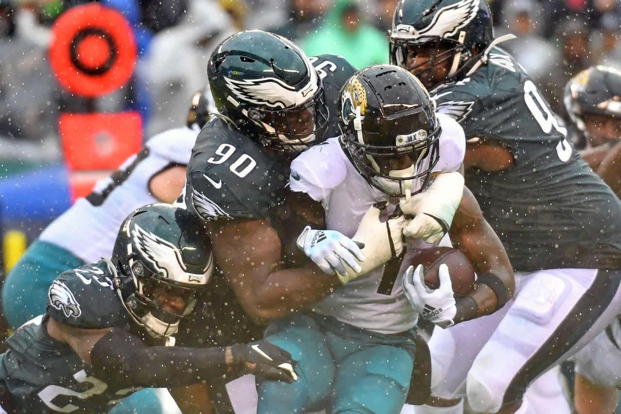 Philadelphia Eagles DT Jordan Davis (90) tackles Jacksonville Jaguars RB Travis Etienne Jr. (1).