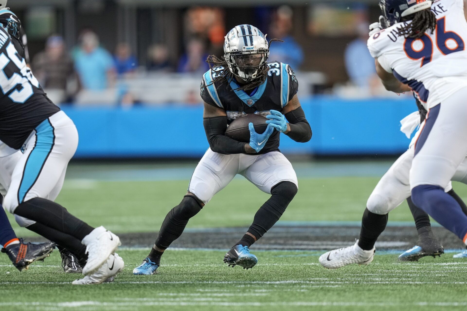 D'Onta Foreman (33) makes a cut on a run play against the Denver Broncos during the second half at Bank of America Stadium.