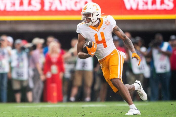 Wide receiver Cedric Tillman (4) runs with the ball against Georgia.