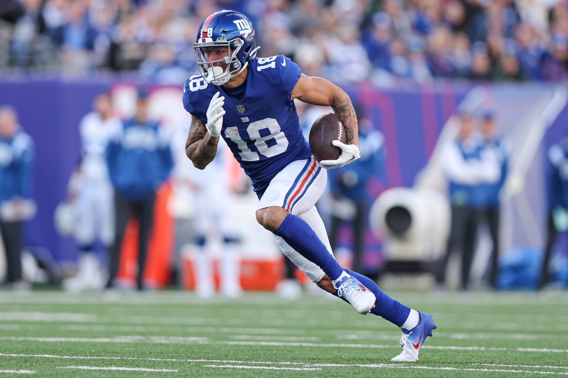 Isaiah Hodgins (18) gains yards after the catch during the first half against the Indianapolis Colts at MetLife Stadium.