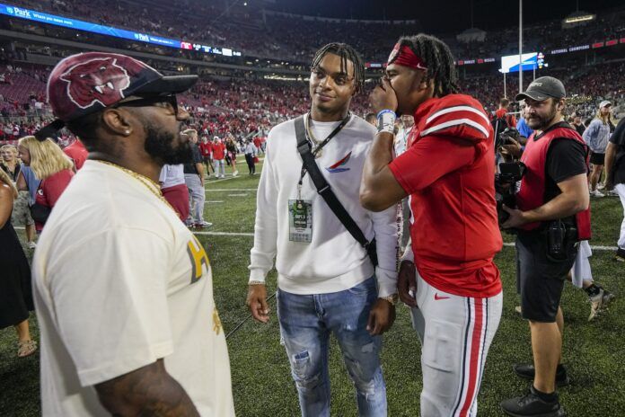 Quarterback C.J. Stroud talks to Justin Fields after a game at Ohio State.