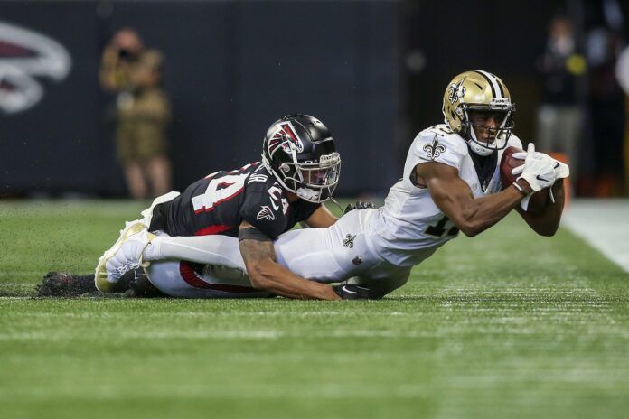 New Orleans Saints WR Michael Thomas (13) makes a diving catch against the Atlanta Falcons.