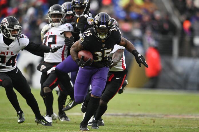 Baltimore Ravens running back Gus Edwards (35) rushes during the game against the Atlanta Falcons.