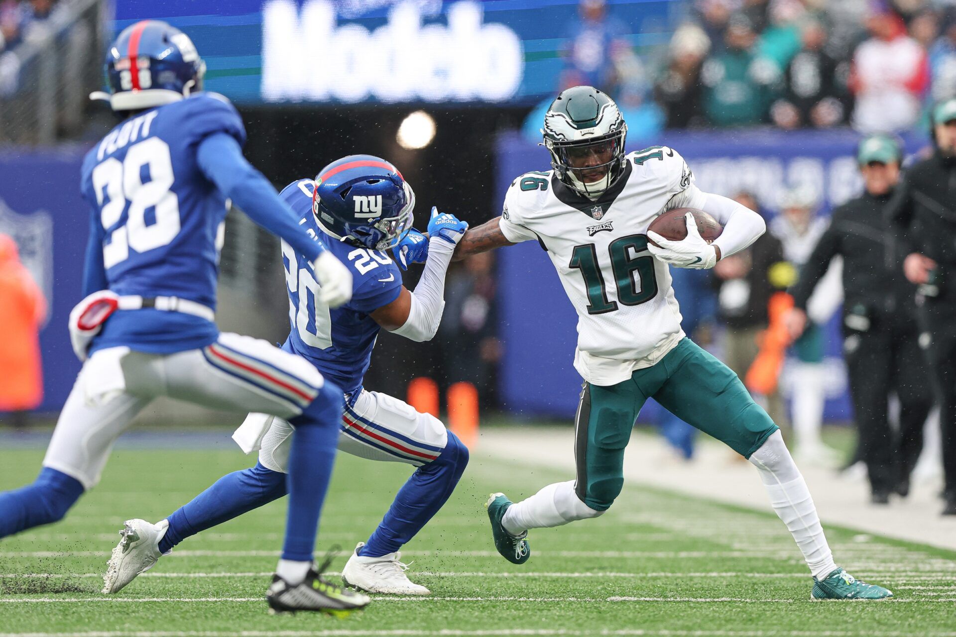 Philadelphia Eagles WR Quez Watkins (16) fights off a tackle by the New York Giants.