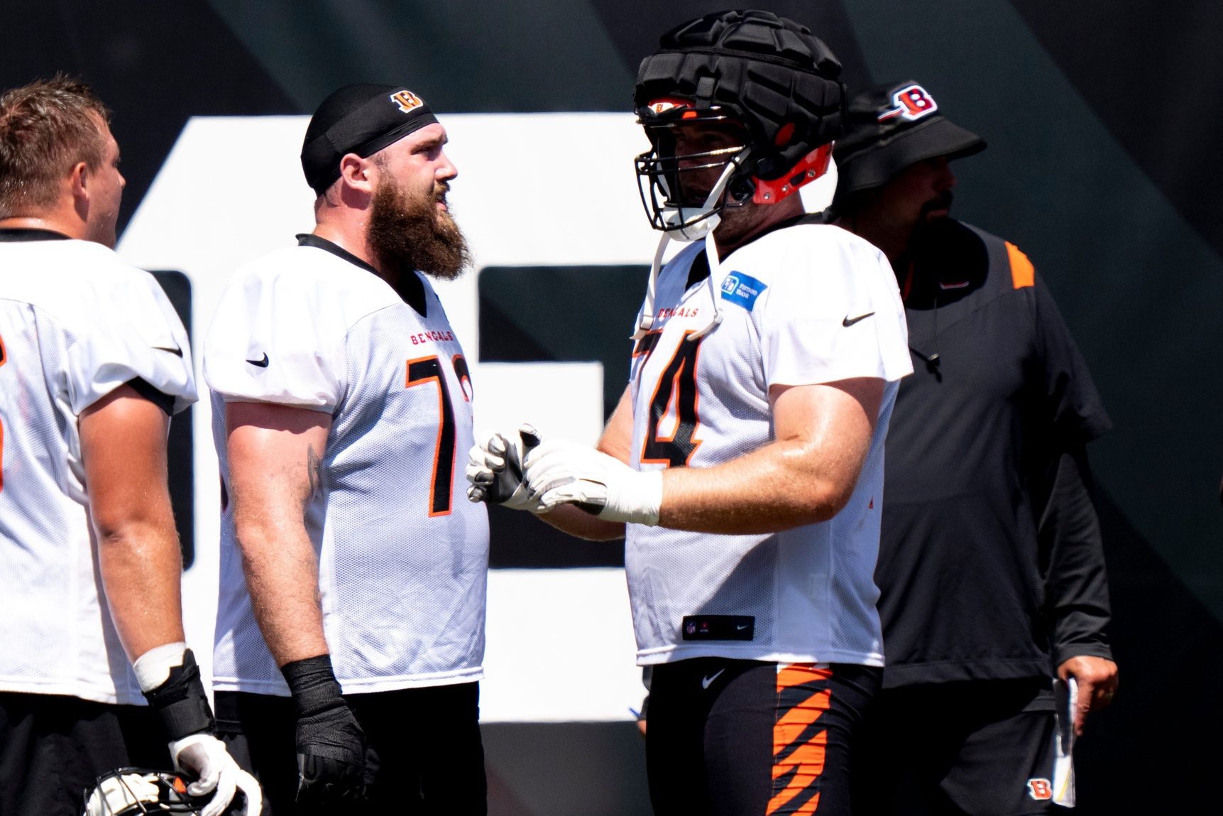 Jonah Williams (73) speaks to Cincinnati Bengals guard Max Scharping (74) during the Cincinnati Bengals fan day practice at Paul Brown Stadium in Cincinnati on Saturday, July 29, 2023.