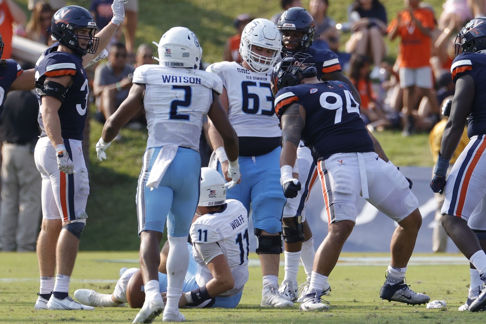 Aaron Faumui (94) celebrates after sacking Old Dominion Monarchs quarterback Hayden Wolff (11) during the fourth quarter at Scott Stadium.