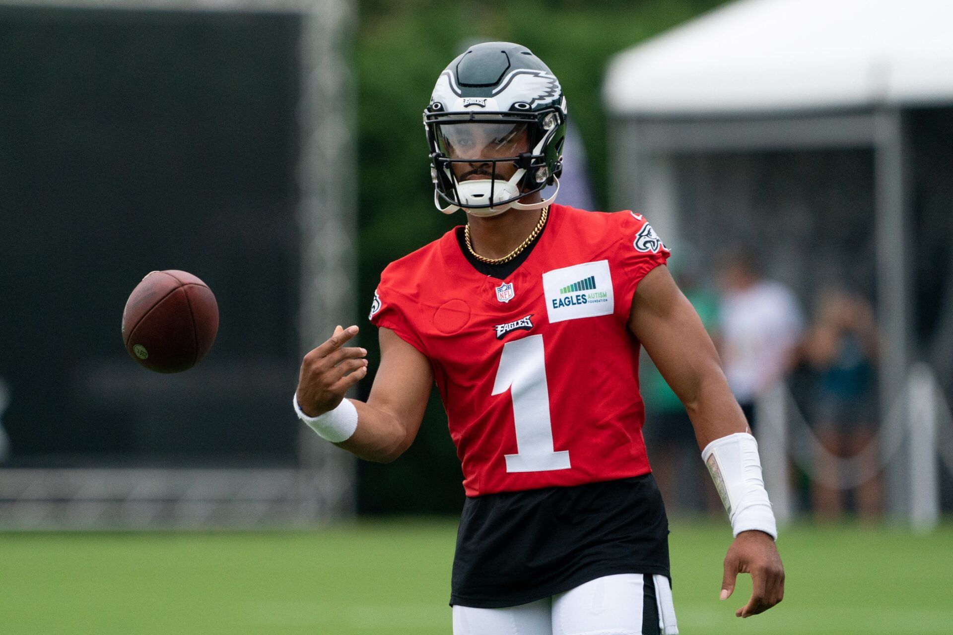 Jalen Hurts (1) tosses a ball during training camp at NovaCare Complex.