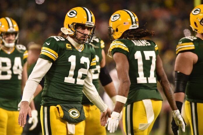 Green Bay Packers QB Aaron Rodgers (12) and WR Davante Adams (17) celebrate after a touchdown.