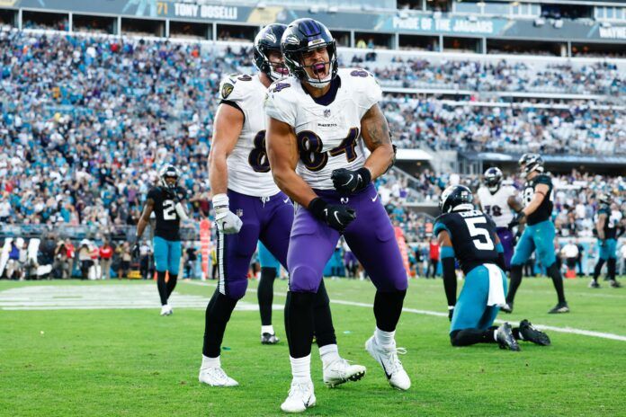 Josh Oliver (84) reacts after scoring a touchdown against the Jacksonville Jaguars during the fourth quarter at TIAA Bank Field.