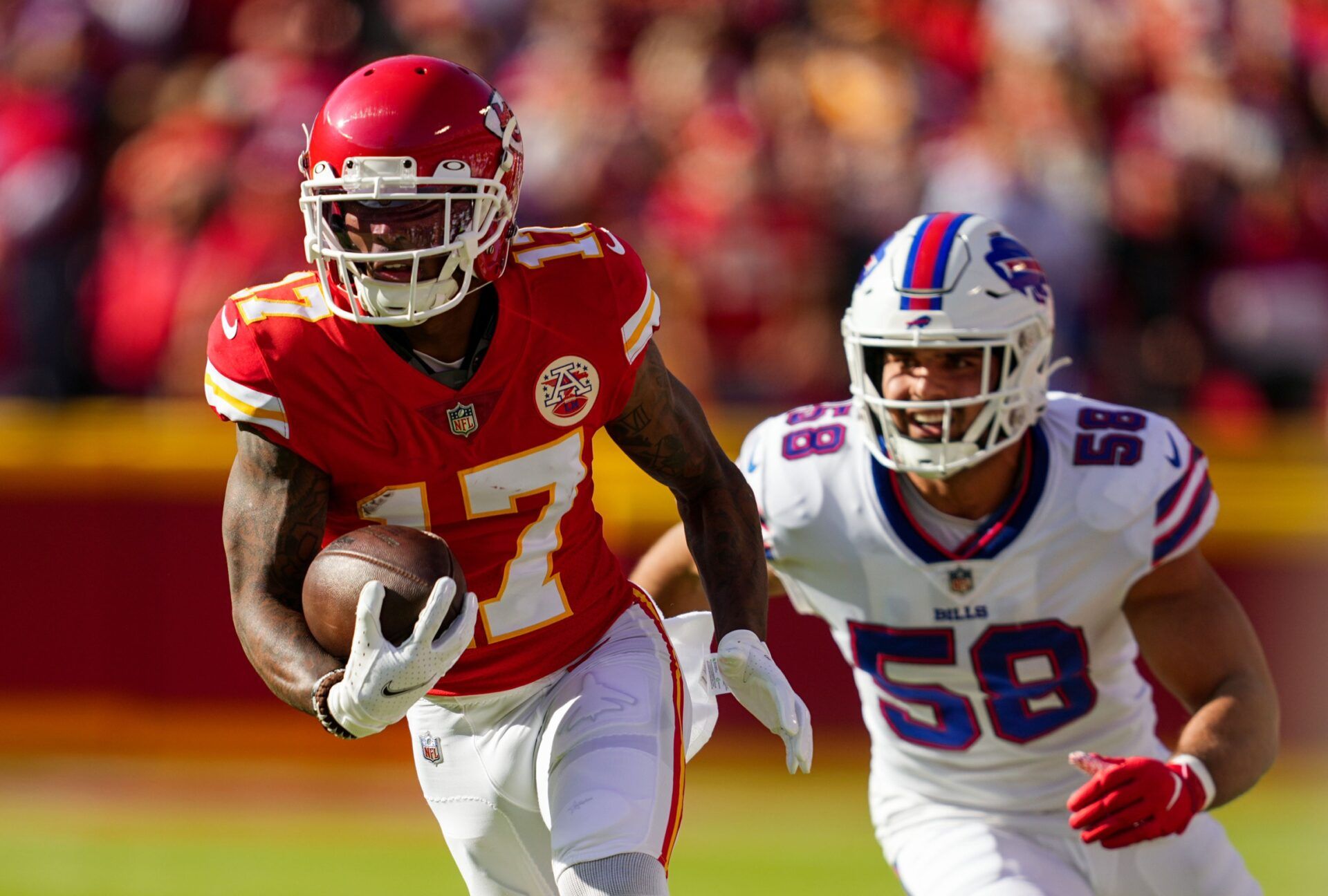 Kansas City Chiefs WR Mecole Hardman (17) runs away from Buffalo Bills LB Matt Milano (58).
