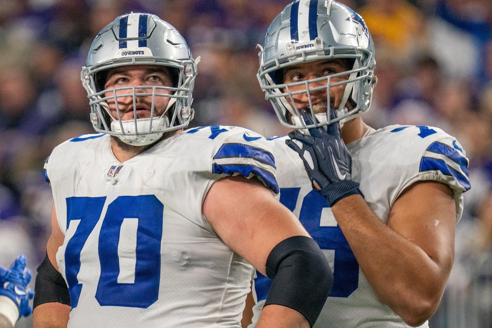 Zack Martin (70) and Dallas Cowboys offensive tackle Terence Steele (78) look at a replay late in the game against the Minnesota Vikings at U.S. Bank Stadium.