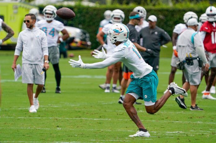 Cedrick Wilson Jr. (11) participates in training camp at Baptist Health Training Complex.