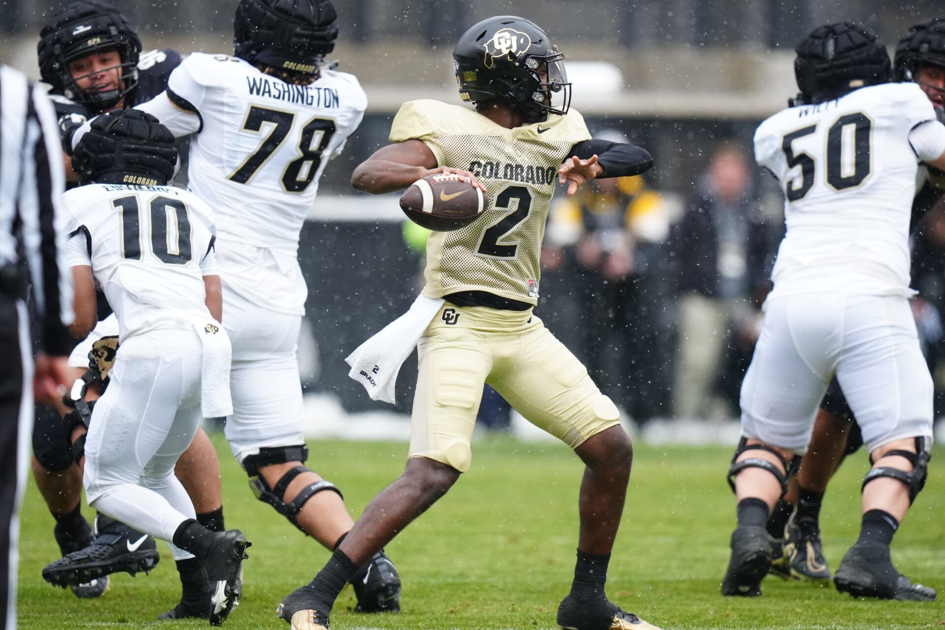 Shedeur Sanders (12) prepares to pass during the first half of the spring game at Folsom Filed.