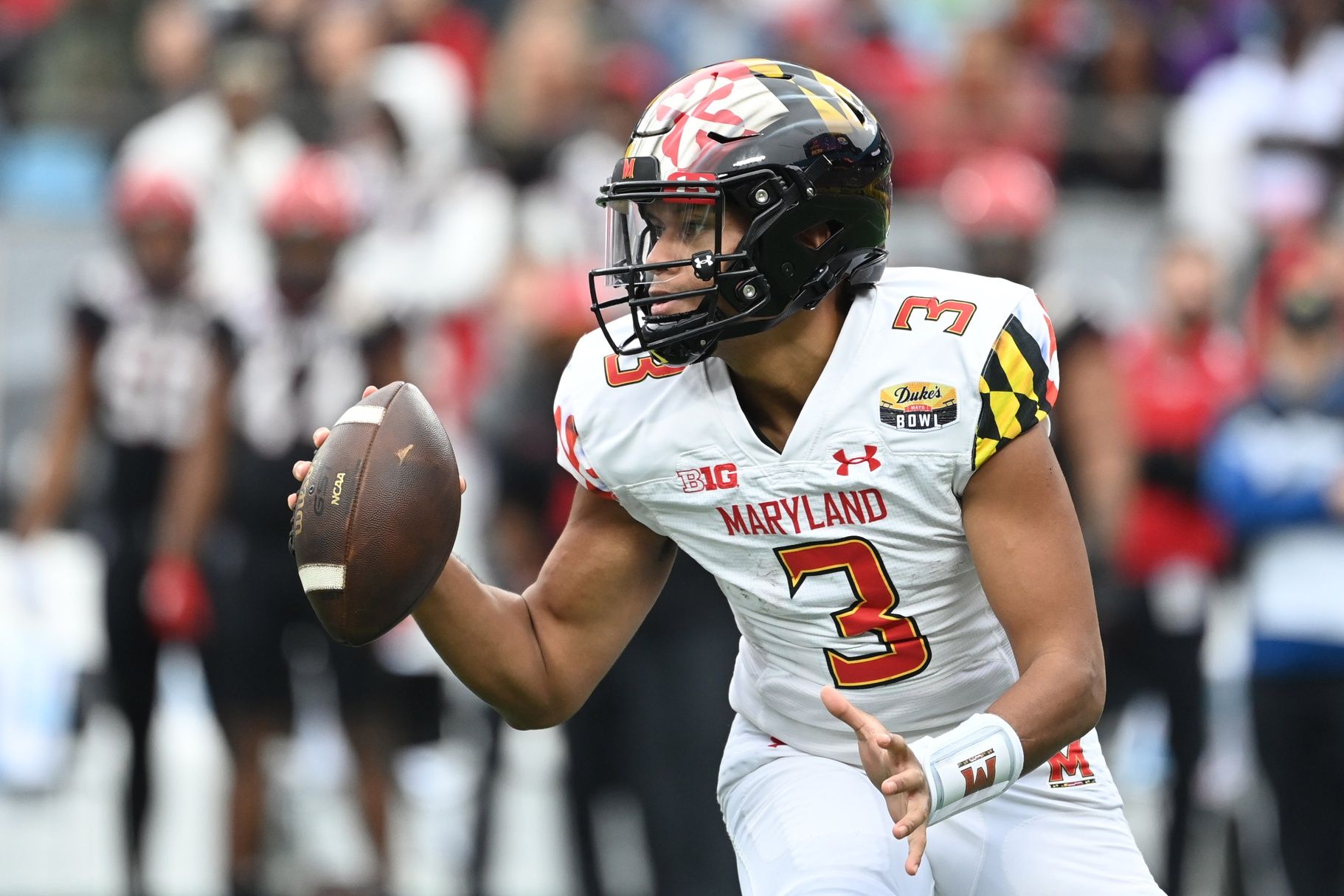 Taulia Tagovailoa (3) looks to pass in the second quarter in the 2022 Duke's Mayo Bowl at Bank of America Stadium.