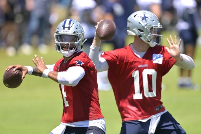 Dak Prescott (4) and quarterback Cooper Rush (10) throw a pass during training camp drills at River Ridge Playing Fields in Oxnard, CA.