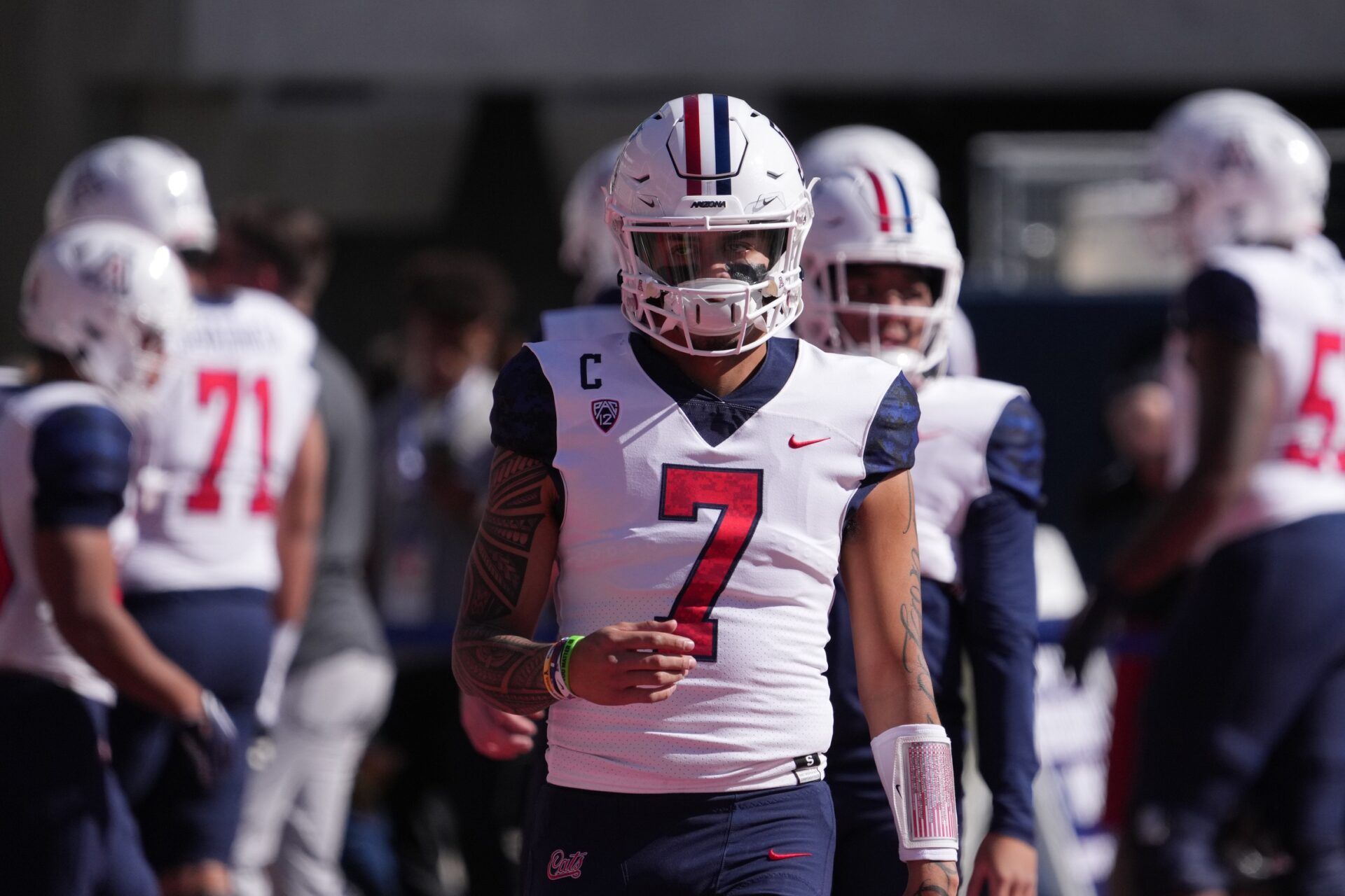 Jayden de Laura (7) warms up prior to facing the Arizona Wildcats at Arizona Stadium.