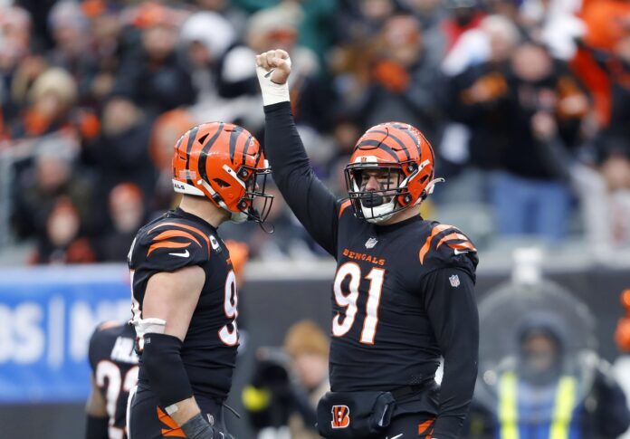 Trey Hendrickson (91) celebrates the sack with defensive end Sam Hubbard (94) during the fourth quarter against the Baltimore Ravens at Paycor Stadium.