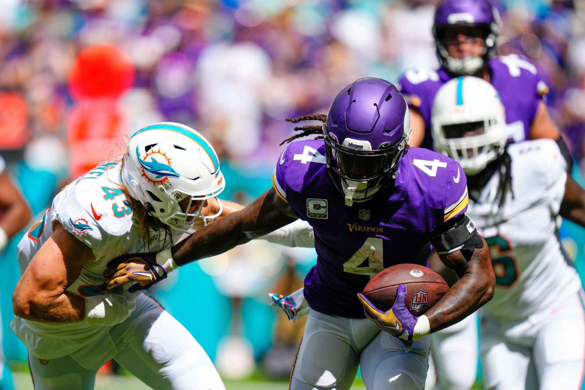 Running back Dalvin Cook (4) tries to break tackles against the Miami Dolphins.