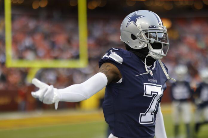 Trevon Diggs (7) gestures on the field during warmups prior to the Cowboys' game against the Washington Commanders at FedExField.