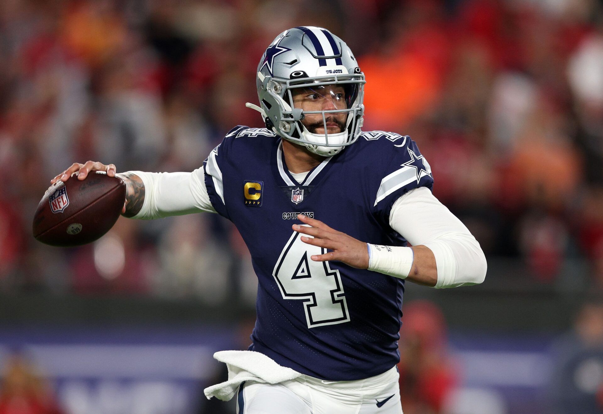 Dak Prescott (4) drops back to pass against the Tampa Bay Buccaneers in the first half during the wild card game at Raymond James Stadium.