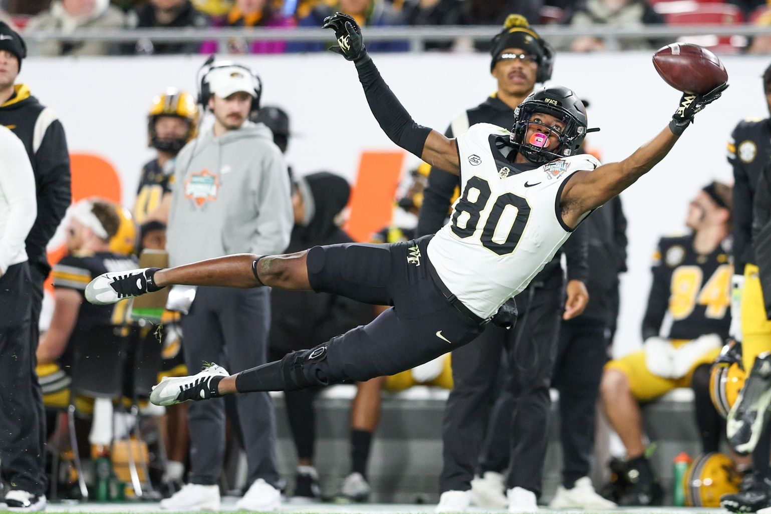 Jahmal Banks (80)(80) leaps for a pass against the Missouri Tigers in the second quarter in the 2022 Gasparilla Bowl at Raymond James Stadium.