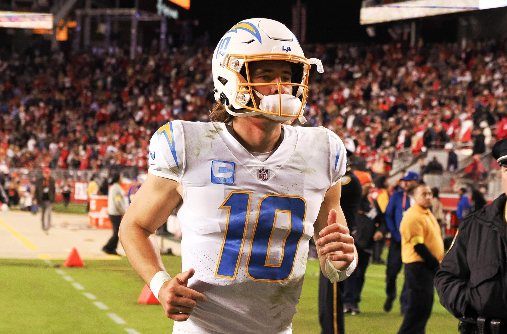 Los Angeles Chargers QB Justin Herbert (10) jogs off the field.