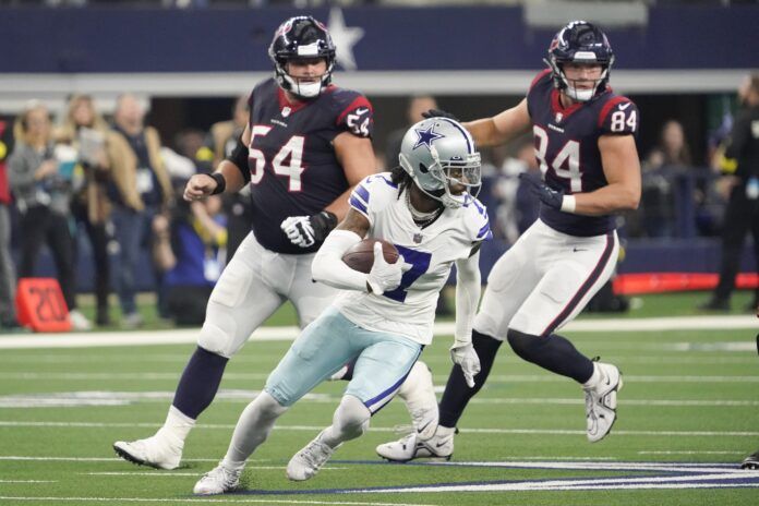 Dallas Cowboys CB Trevon Diggs (7) runs with the ball after recovering a fumble against the Houston Texans.