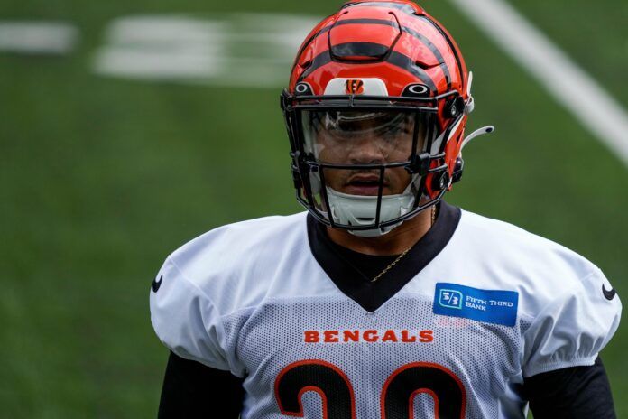 Cincinnati Bengals running back Chase Brown (30) walks through a drill at the team's camp.