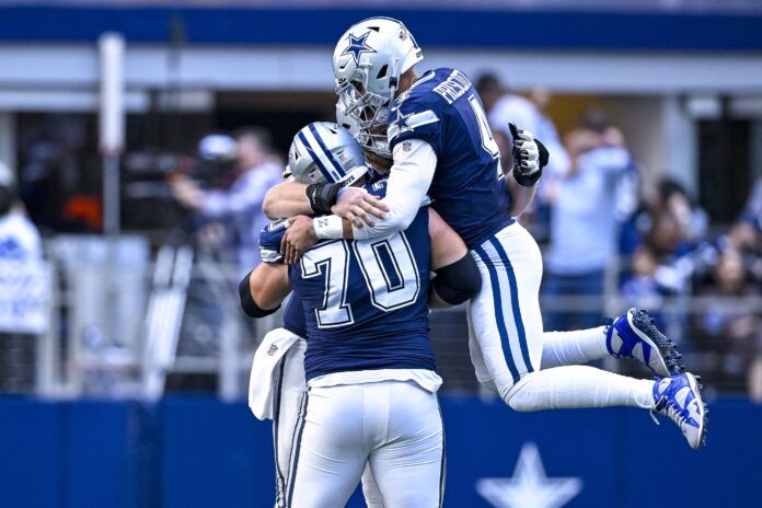 Dallas Cowboys QB Dak Prescott (4) and G Zack Martin (70) celebrate a touchdown.