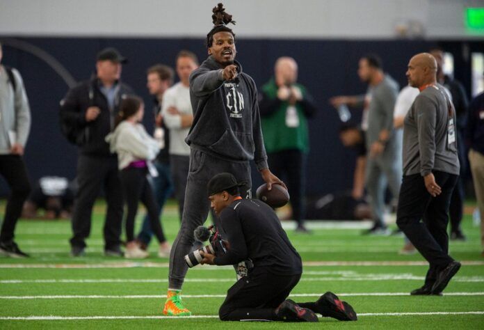 NFL quarterback Cam Newton runs a drill at Auburn's Pro Day.