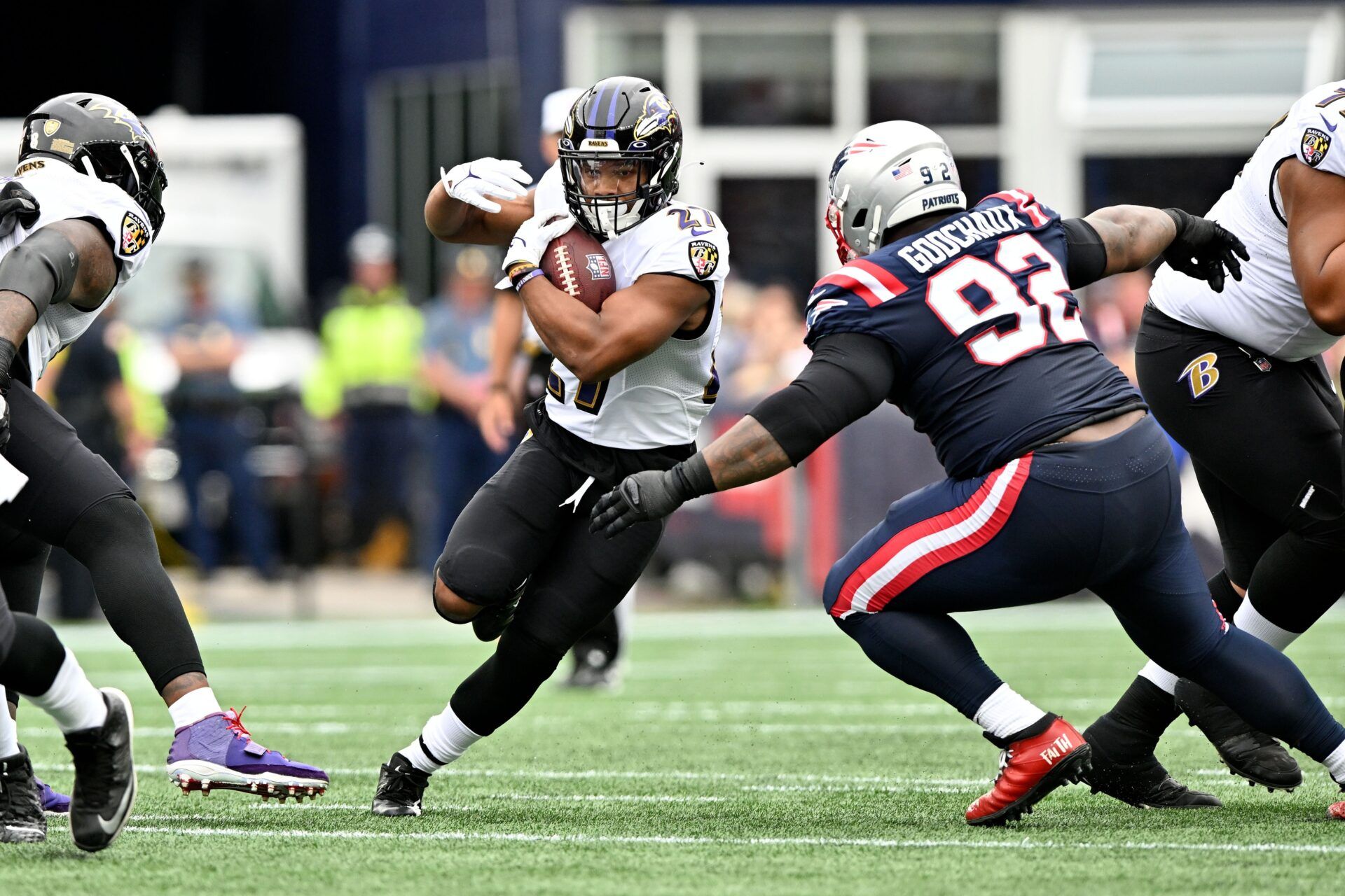 Baltimore Ravens RB J.K. Dobbins (27) rushes the ball against the New England Patriots.