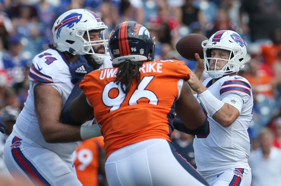 Eyioma Uwazurike (96) as his quarterback Case Keenum looks downfield in the first half of the Bills preseason game against Denver.