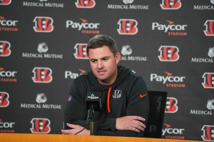 Zac Taylor answers questions about the draft during a press conference.