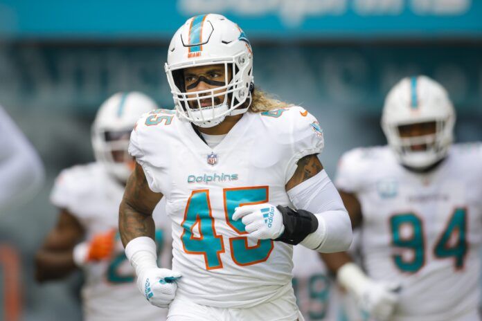 Miami Dolphins LB Duke Riley (45) runs out onto the field.