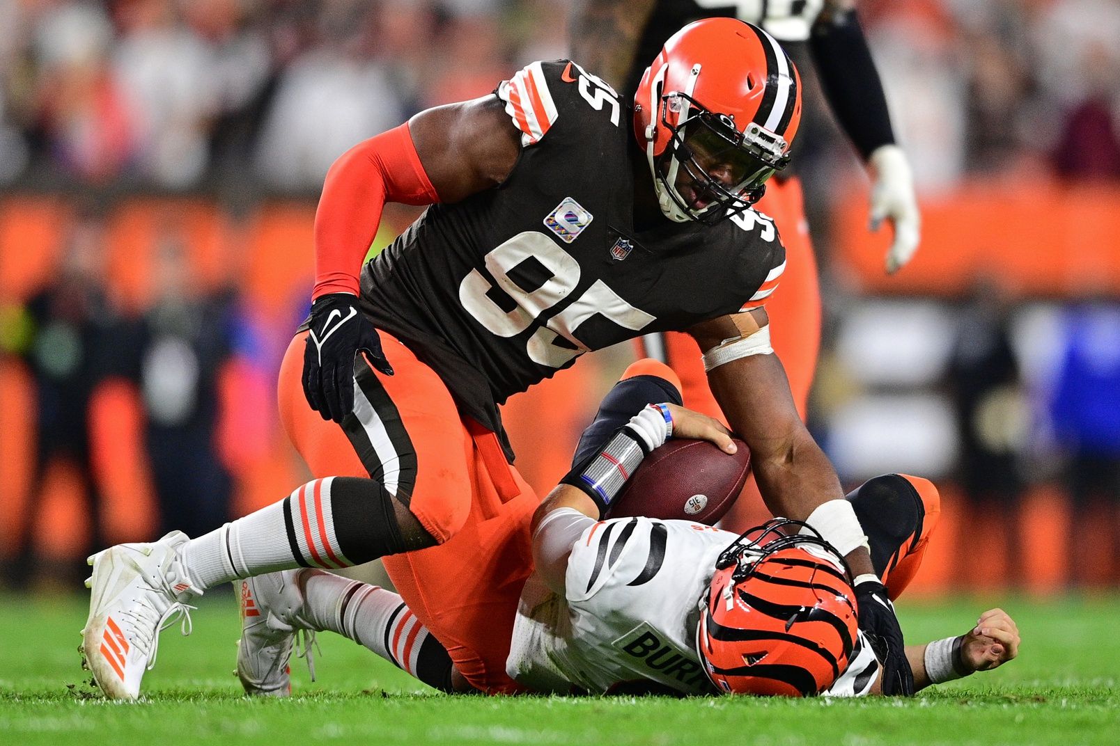 Myles Garrett (95) sacks Cincinnati Bengals quarterback Joe Burrow (9) in the fourth quarter at FirstEnergy Stadium.