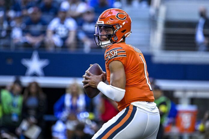 Justin Fields drops back to pass.